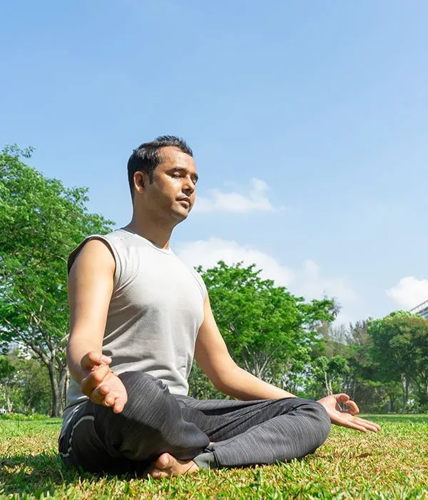 Master Ayush Kumar meditating outdoors